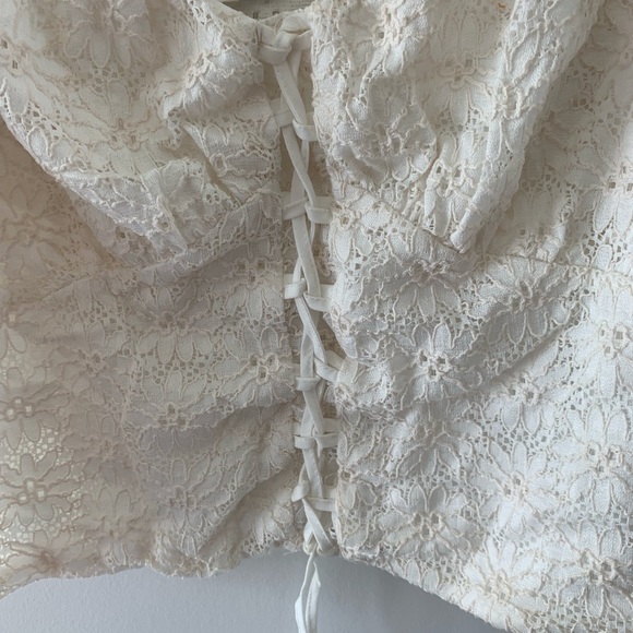 Laced, tie up bodice crop top with puff sleeves in white. - Picture 3 of 3